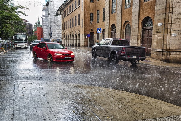 Cars driving in the city centre, downpour, motion blur, Stockholm, Sweden, Europe