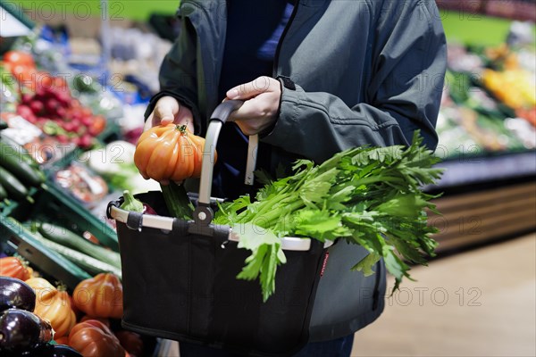 Woman shopping at the supermarket. Radevormwald, Germany, Europe