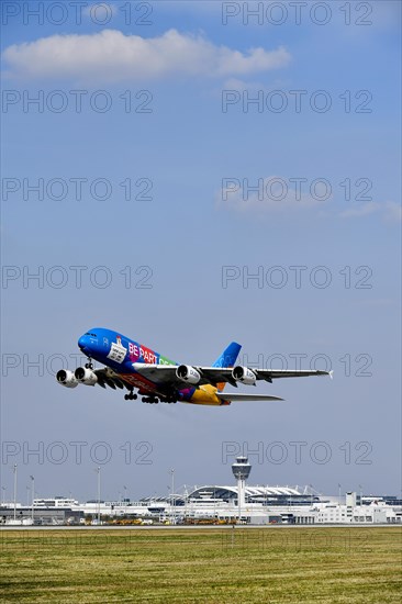 Emirates Airlines special livery Expo Dubai 2021-2022 Airbus A380-800 taking off with tower, Munich Airport, Upper Bavaria, Bavaria, Germany, Europe