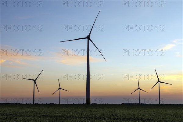 Wind farm in fields near Neuss after sunset, Neuss, North Rhine-Westphalia, Germany, Europe