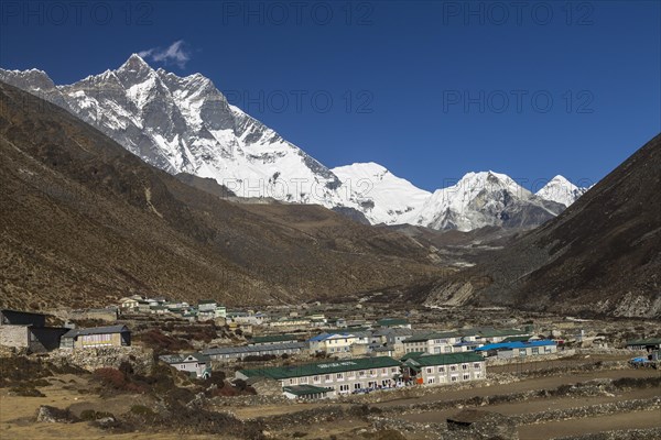 Dingboche settlement, located in the Imja Khola Valley, at the foot of the eight-thousander Lhotse, with its huge mountaineering challenge, the Lhotse South Face. Other peaks belonging to the main Himalayan ridge, Shartse and Cho Polu, are further up-valley as well as Imja Tse, also known as Island Peak, the popular trekking peak. The Himalayas, the Everest Region known as Khumbu Region. Sagarmatha National Park, a UNESCO World Heritage Site. Solukhumbu, Nepal, Asia