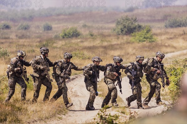 Soldiers of the Jaegerbataillon 292 train a combat situation at the Bundeswehr Combat Training Centre in Letzling The soldiers wear AGDUS equipment