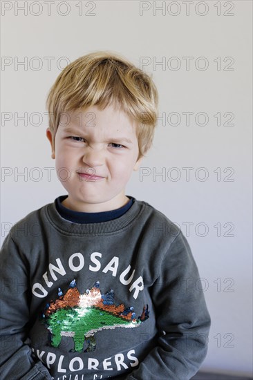 Bonn. Toddler shows his feelings, here the feeling of scepticism. Bonn, Germany, Europe