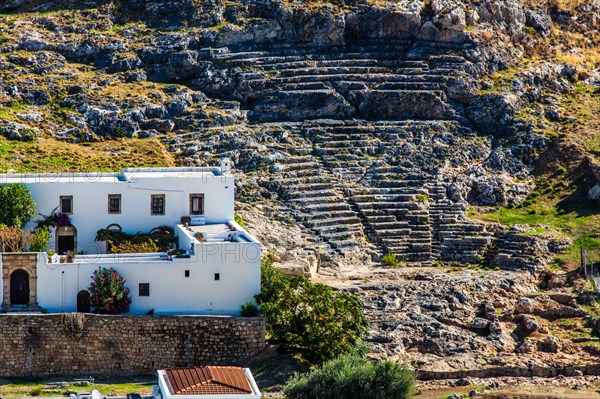 Ancient theatre from the 4th century with over 25 rows of seats for 2000 visitors, Lindos, Rhodes, Greece, Europe