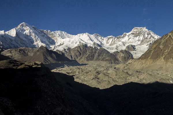 Upper part of Dudh Koshi valley, where Ngozumpa Glacier, the longest in the Himalayas, begins. At the valley head, a part of the main Himalayan ridge stretches between the eight-thousander Cho Oyu, the sixth-highest mountain, and Gyachung Kang on the right side, the highest mountain below 8000 m. Between them is Tenzing Peak and Hillary Peak. Gokyo trek. Khumbu, the Everest Region, Himalayas. Sagarmatha National Park, a UNESCO World Heritage Site. Solukhumbu, Nepal, Asia