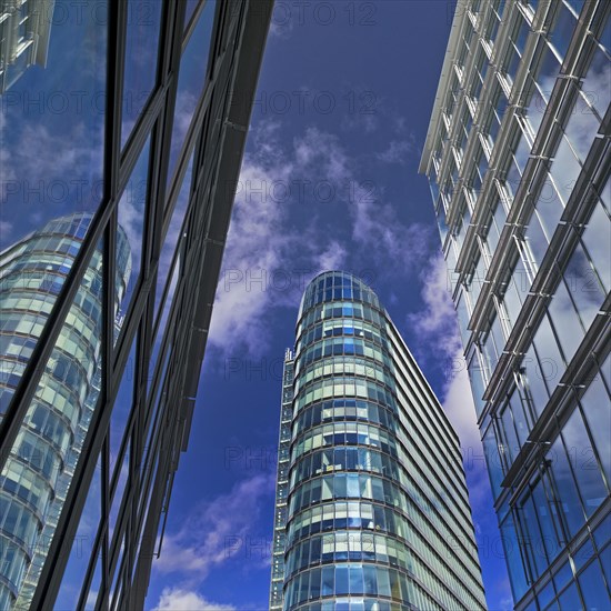 High-rise WorkRepublic MedienHafen reflected in glass facades, Duesseldorf, North Rhine-Westphalia, Germany, Europe