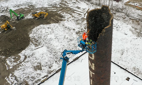 Detroit, Michigan USA, 23 January 2023, Workers tear down the chimney of the power plant at Continental Motors. It is the last of several buildings to be demolished. The plant made auto and aircraft engines from 1912 until 1955, employing as many as 8, 000 workers