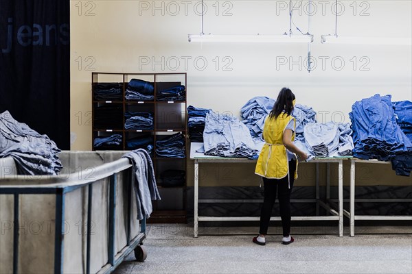 A worker sorts jeans at the Afrasyab jeans factory in Samarkand, 02.11.2022., Samarkand, Uzbekistan, Asia