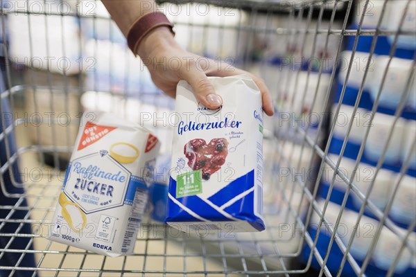 Sugar and gelling sugar in a shopping trolley. Radevormwald, Germany, Europe