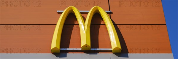 Facade with logo and sign, M, McDonald, fast food restaurant, Hagen, North Rhine-Westphalia, Germany, Europe