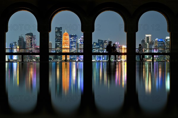 View of the illuminated skyline of Doha, Qatar, from the terrace of the Museum of Islamic Art by the archtics Ieoh Ming Pei and Jean-Michel Wilmotte, Asia