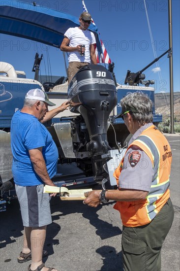 Gunnison, Colorado, Carol Soell, a boat inspector at Curecanti National Recreation Area, checks boats entering and leaving Blue Mesa Reservoir for invasive species. Colorados mandatory inspection program aims to keep zebra and quagga mussels, New Zealand mudsnails, Eurasian Watermilfoil, rusty crayfish, and waterfleas out of the states waters