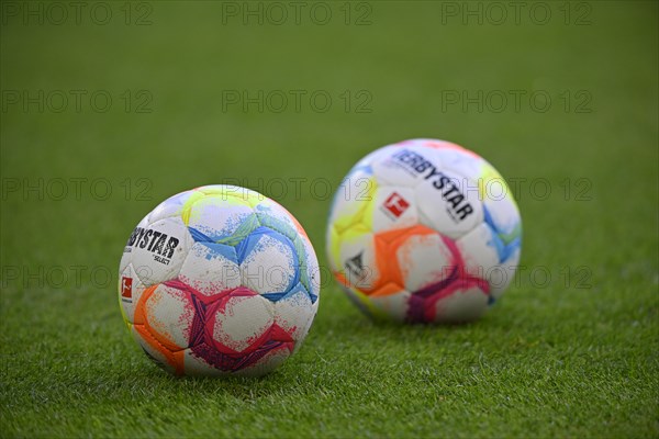 Adidas Derbystar match balls lie on grass, Allianz Arena, Munich, Bavaria, Germany, Europe