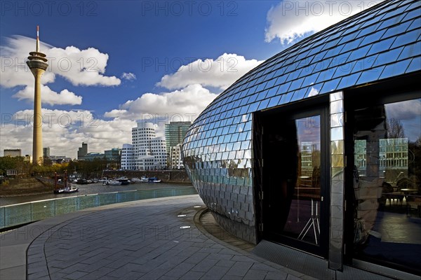 Restaurant terrace with the Rhine Tower and the Gehry buildings, Media Harbour, Duesseldorf, North Rhine-Westphalia, Germany, Europe