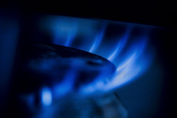 Symbolic photo on the subject of rising costs for gas. Flames in a gas cooker. Berlin, Berlin, Germany, Europe