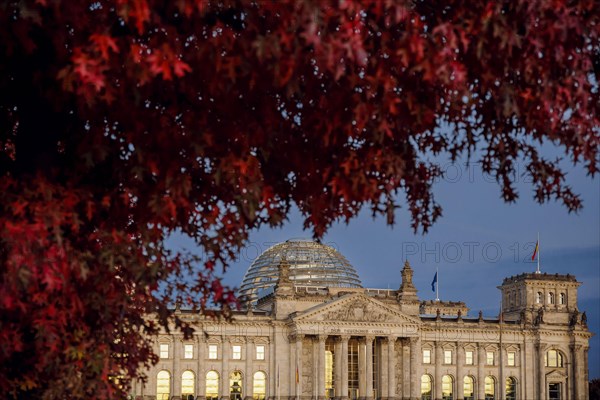 The evening sky is reflected in the windows of the Reichstag building on an evening in autumn. Berlin, Berlin, Germany, Europe