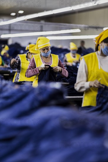 Women workers produce jeans at the Afrasyab jeans factory in Samarkand, 02.11.2022., Samarkand, Uzbekistan, Asia