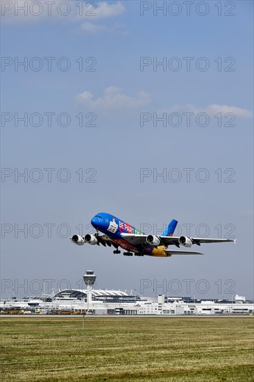 Emirates Airlines special livery Expo Dubai 2021-2022 Airbus A380-800 taking off with tower, Munich Airport, Upper Bavaria, Bavaria, Germany, Europe