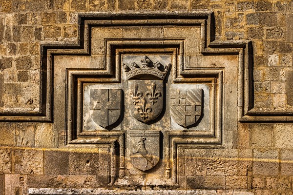 Coat of arms on the French hostelKnights Street in Old Town from the time of the Order of St. John, the only surviving 16th century street in the late Gothic style, Oddos Ippoton, Rhodes Town, Greece, Europe