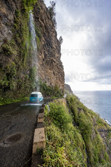 Cascata dos Anjos, car driving through waterfall, coastal road, Madeira, Portugal, Europe