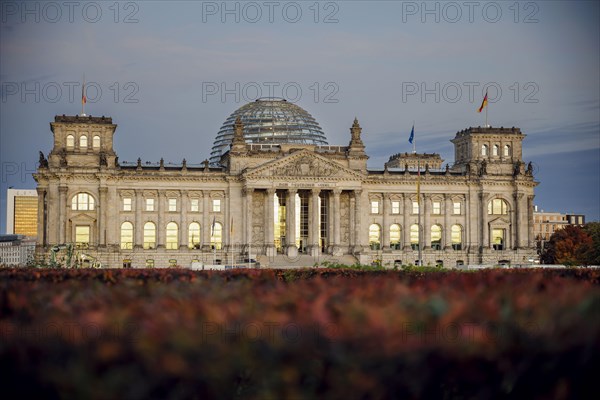 The evening sky is reflected in the windows of the Reichstag building on an evening in autumn. Berlin, Berlin, Germany, Europe