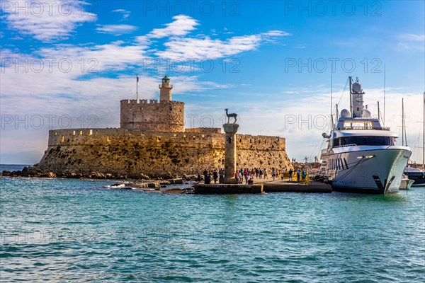 Mandraki harbour, harbour entrance with columns with stag and hind, site of the Colossus of Rhodes, Rhodes Town, Greece, Europe