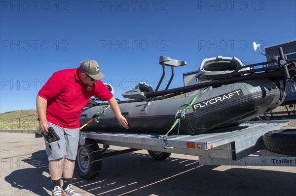 Evanston, Wyoming, An employee of the Wyoming Game & Fish Department inspects watercraft at a mandatory inspection station along the Utah border. The intent is to keep invasive aquatic species, including zebra mussels and quagga mussels, out of the states waters