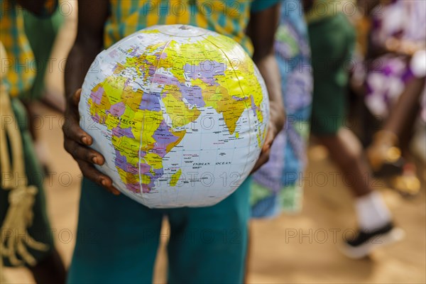 Theme: School children in Africa with an inflatable globe, Krokrobite, Ghana, Africa