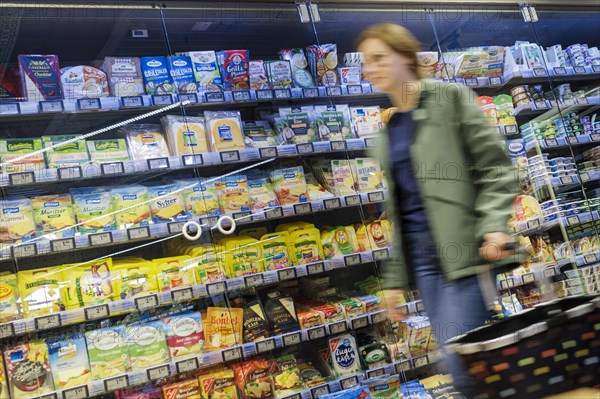 Elderly woman shopping in supermarket, Radevormwald, Germany, Europe