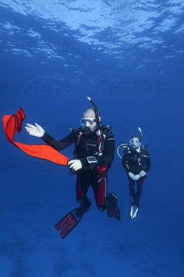 Diver, diver, exercise, set safety buoy, roll out 1st safety buoy, Red Sea, Hurghada, Egypt, Africa