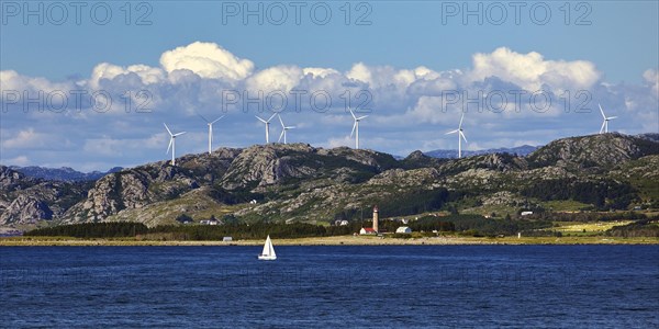 North Sea with coastal landscape, sailboat and Lista fyr lighthouse, Lista peninsula, Steinodden, Norway, Europe