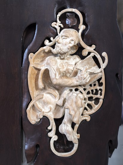 Carved figure on the ambo in the Catholic parish church of St. Peter and Paul, former collegiate church, Romanesque columned basilica, Unesco World Heritage Site, Niederzell on the island of Reichenau in Lake Constance, Constance district, Baden-Wuerttemberg, Germany, Europe