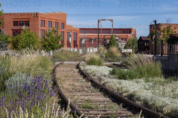 Evanston, Wyoming, The historic roundhouse and railyards, built by the Union Pacific Railroad in 1912. The building had 28 bays for railcar and locomotive repair, with curved walls 30 feet high. UPRR closed the facility in 1971. It is now owned by the city of Evanston and has been partially renovated