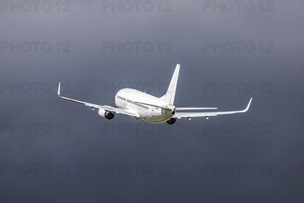 Aircraft of type Boeing 737-300 of the airline BUL AIR during take-off and climb, neutral livery, Stuttgart, Baden-Wuerttemberg, Germany, Europe