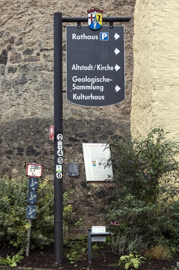 Information signs in the medieval town centre of Hillesheim, with a fortified defence tower of the 13th century town fortifications, Hillesheim, Rhineland-Palatinate, Germany, Europe