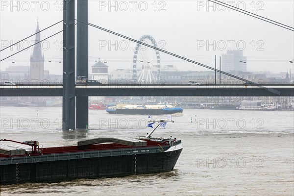 Flooding on the Rhine in Duesseldorf - View of Rheinkniebruecke, Old Town with Lambertus Church, Castle Tower and Ferris Wheel, Duesseldorf, North Rhine-Westphalia, Germany, Europe