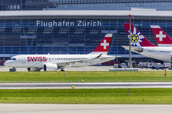 Airport ZRH with aeroplanes of the airline Swiss as well as Edelweiss, terminal with the inscription Airport, Zurich, Switzerland, Europe