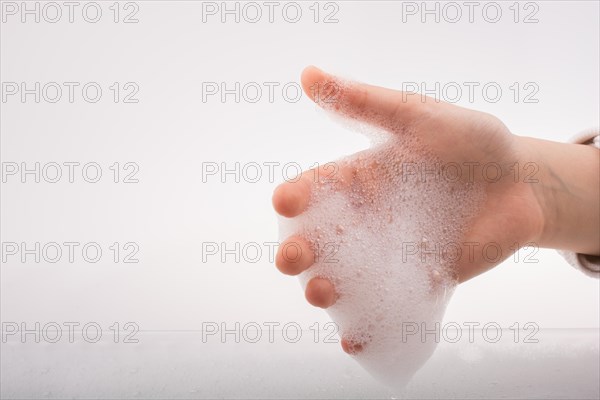 Hand washing and soap foam on a foamy background