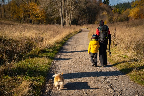 Mum and child are walking along the mountain hiking trail. Family spending time. Polish mountains