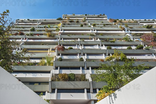 High-rise building with green balconies in the former Olympic Village