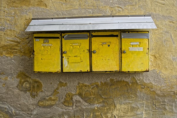 Old battered house letter boxes
