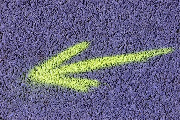 Arrow spray painted on road