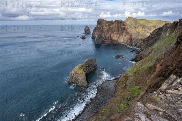 Red cliffs and rocks in the sea