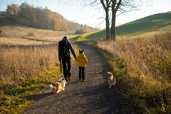 Mum and child are walking along the mountain hiking trail. Family spending time. Polish mountains