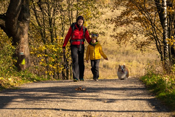 Mum and child are walking along the mountain hiking trail. Family spending time. Polish mountains