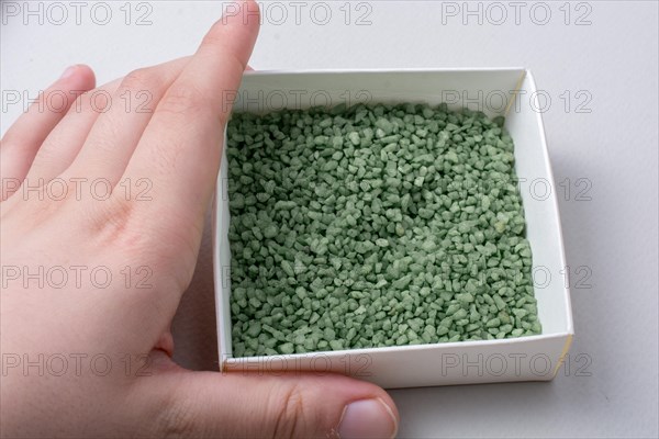 Little green color sand in box as a background texture