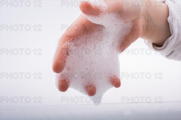 Hand washing and soap foam on a foamy background