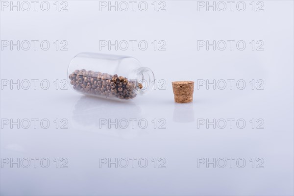 Little perfume glass bottle on a white background