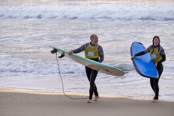 Surfers on the beach at Jeffreys Bay near Port Elizabeth