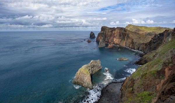 Red cliffs and rocks in the sea